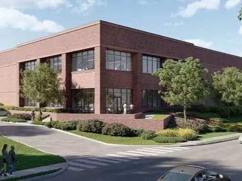 A rendering of the exterior of an office building.