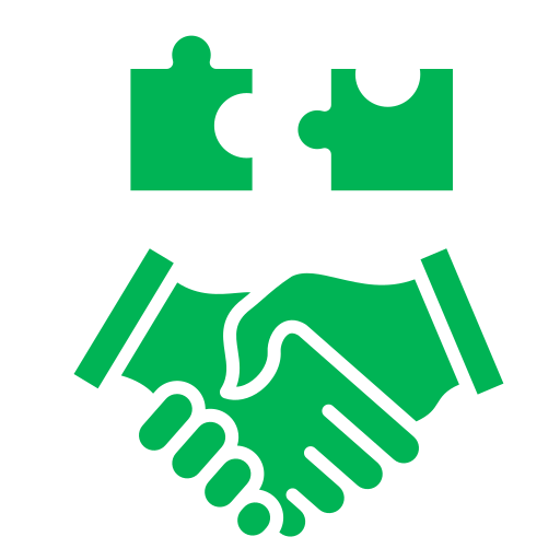 Two green puzzle pieces above a pair of shaking hands, symbolizing cooperation and collaboration.