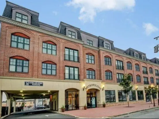 A large brick building with many windows on the outside.